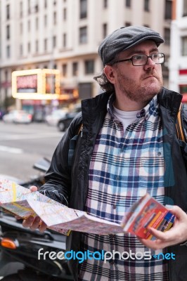 Hipster Young Man Looking The Map In A Urban Scene Stock Photo