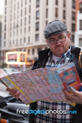 Hipster Young Man Looking The Map In A Urban Scene Stock Photo