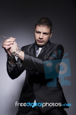 His Hands Are In Chains Stock Photo