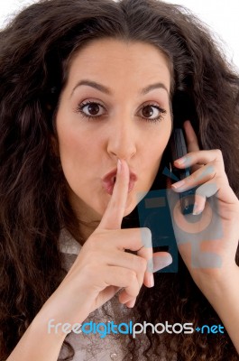 Hispanic Female Busy With Mobile Stock Photo