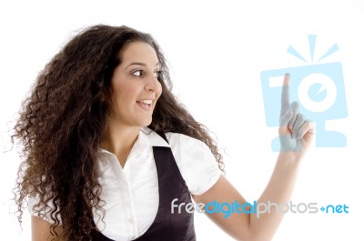 Hispanic Female Pointing Upwards Stock Photo