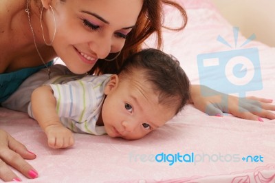 Hispanic Mother And Her Newborn Baby Stock Photo