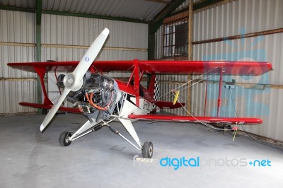 Historic Aeroplane In Hangar Stock Photo