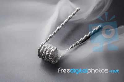 Hive Coil For Vaping On A Black Background Somke Stock Photo