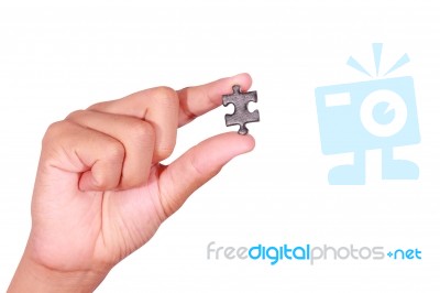 Holding A Blank Jigsaw Piece Stock Photo