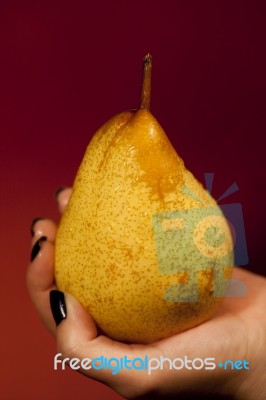 Holding A Pear Stock Photo