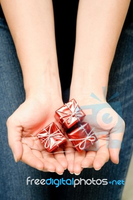 Holding Small Christmas Box Stock Photo