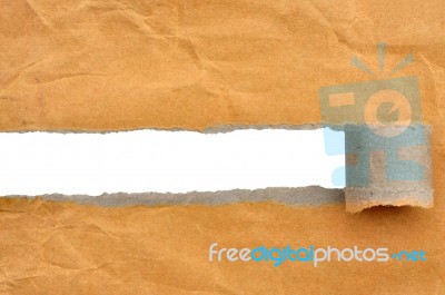 Hole In Brown Paper Stock Photo