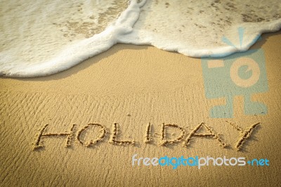 Holiday Text Written On The Beach Stock Photo