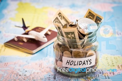 Holidays Budget Concept With Compass, Passport And Aircraft Toy Stock Photo