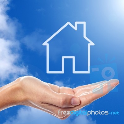 Home Icon On Sky Background Stock Photo