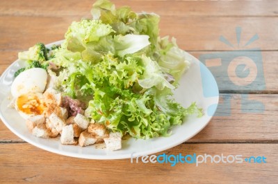 Homemade Salad Serving On Wooden Background Stock Photo