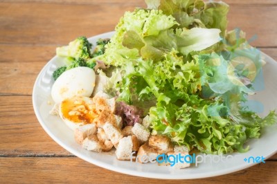 Homemade Salad Serving On Wooden Background Stock Photo