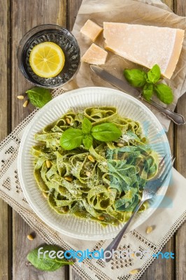 Homemade Spinach Pasta With Pesto And Parmesan Cheese Stock Photo