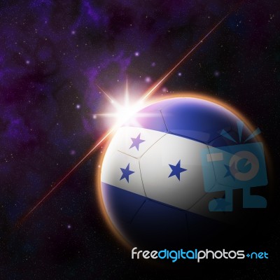 Honduras  Flag On 3d Football With Rising Sun Stock Image