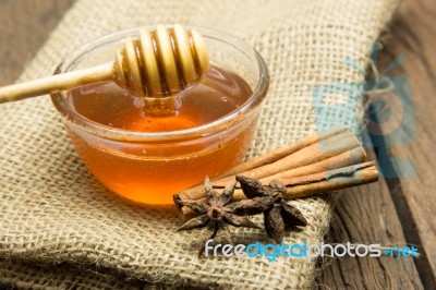 Honey In Bowl On Canvas Background Stock Photo