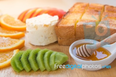 Honey Toast And Ice Cream With Mixed Fruit On Bread Stock Photo