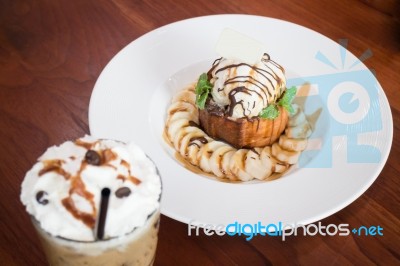 Honey Toast With Banana And Ice Coffee Stock Photo