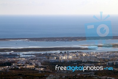 Horizon View Of Olhao Coastline Stock Photo