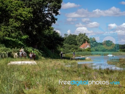 Horse Riding And Walking The Dog By The River Alde Stock Photo