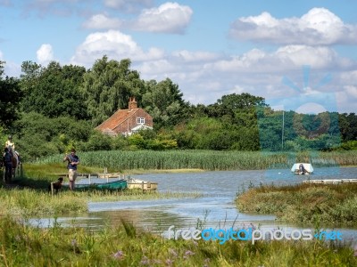 Horse Riding And Walking The Dog By The River Alde Stock Photo