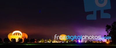 Hot Air Ballons And Tents In The Evening During A Festival Stock Photo