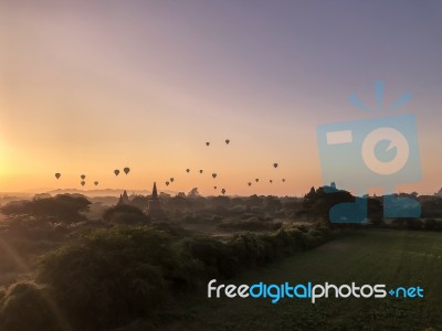 Hot Air Balloons During Sunrise Over Religious Temples Stock Photo