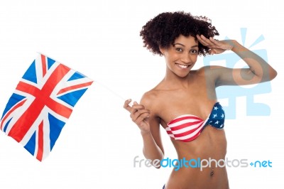 Hot American Bikini Model Saluting And Waving Uk Flag Stock Photo