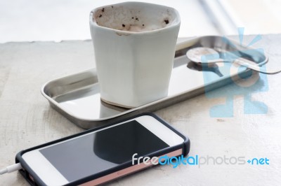 Hot Chocolate Cup And Smart Phone Stock Photo