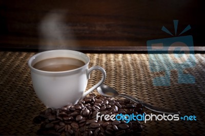 Hot Coffee And Roast Bean On Wood Stock Photo