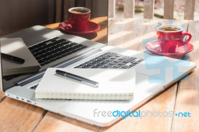 Hot Coffee Cup On Wooden Work Station Stock Photo