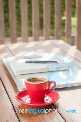 Hot Coffee Cup On Wooden Work Station Stock Photo