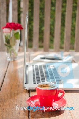 Hot Coffee Cup On Wooden Work Station Stock Photo