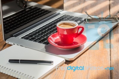 Hot Coffee Cup On Wooden Work Station Stock Photo