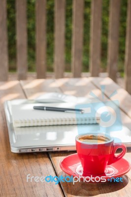 Hot Coffee Cup On Wooden Work Station Stock Photo