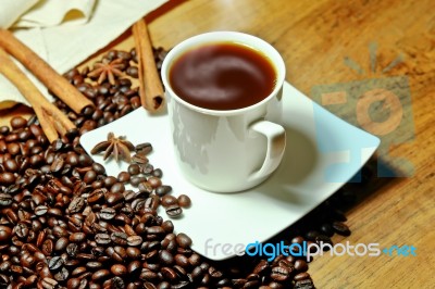 Hot Coffee With Beans And Herbal Stock Photo