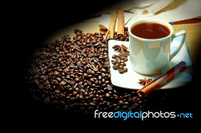 Hot Coffee With Beans On The Table Stock Photo