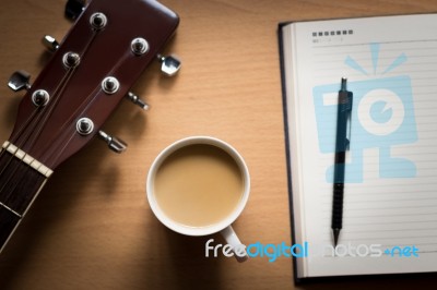 Hot Coffee With Guitar And Notepad Break Time For Thinking Idea Stock Photo