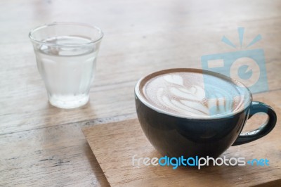 Hot Cup Of Coffee On Wooden Table Stock Photo