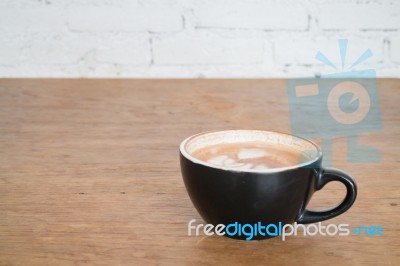 Hot Cup Of Coffee On Wooden Table Stock Photo