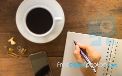 Hot Cup Of Coffee On Wooden Work Table Stock Photo