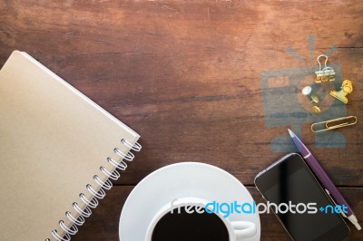 Hot Cup Of Coffee On Wooden Work Table Stock Photo