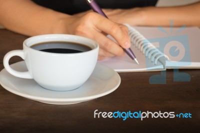 Hot Cup Of Coffee On Working Table Stock Photo