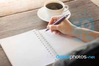 Hot Cup Of Coffee On Working Table Stock Photo