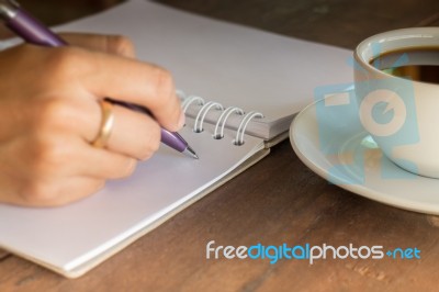 Hot Cup Of Coffee On Working Table Stock Photo