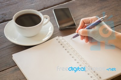 Hot Cup Of Coffee On Working Table Stock Photo