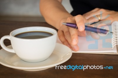 Hot Cup Of Coffee On Working Table Stock Photo