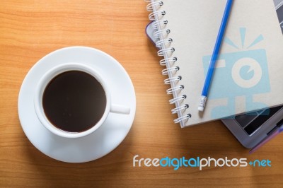 Hot Cup Of Coffee On Working Table Stock Photo