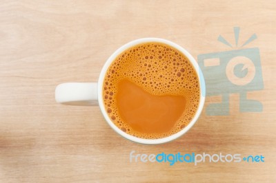 Hot Milk Tea In A White Cup On Table Stock Photo