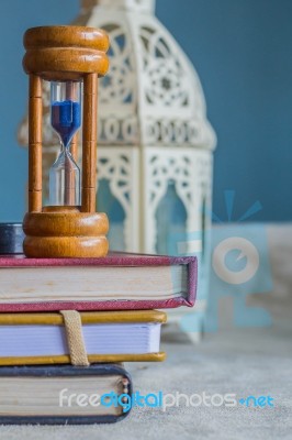 Hourglass On A Book Stock Photo